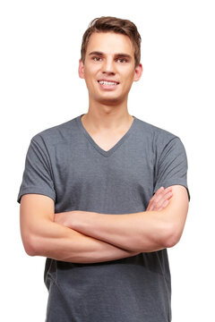 Fashion, crossed arms and portrait of happy man in studio with confidence, attractive and pride on white background. Smile, style and face of isolated handsome male person with trendy casual clothes