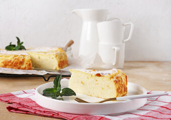 Italian casserole Migliaccio piece of pie, with ricotta cheese and orange zest , copy space