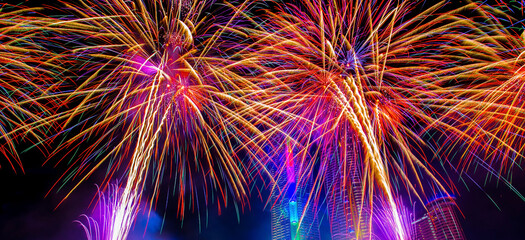 Colorful fireworks in celebrate new year at Chao Phraya river in Bangkok, Thailand.