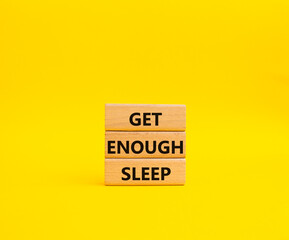 Get enough sleep symbol. Wooden blocks with words Get enough sleep. Beautiful yellow background. Healthy lifestyle, medical and Get enough sleep concept. Copy space.