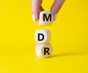 BPM - Business Process Management symbol. Wooden cubes with words BPM. Businessman hand. Beautiful...