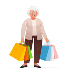 An elderly woman in glasses stands with multi-colored paper bags from shopping. Happy grandmother with packages goes shopping.