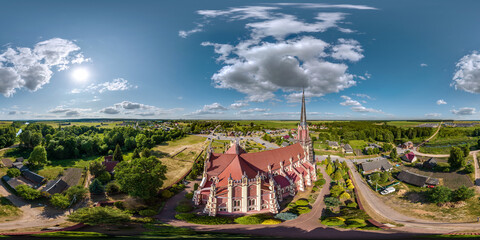 full hdri 360 panorama aerial view on red brick neo gothic or baroque catholic church in...
