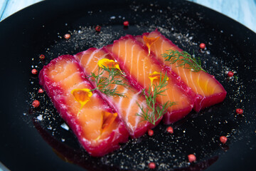 Recipe for gravlax salmon marinated with beet and avocado mayonnaise sauce. High quality photo