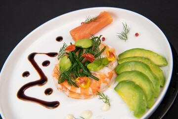 Recipe Fish Appetizer shrimp carpaccio, smoked salmon, avocado, samphire, broad beans, lemon sauce, olive oil, served with mayonnaise in white round plate, High quality photo