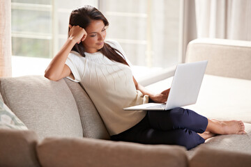 Laptop, internet and a woman relax at home while streaming movies. Calm female person on lounge...