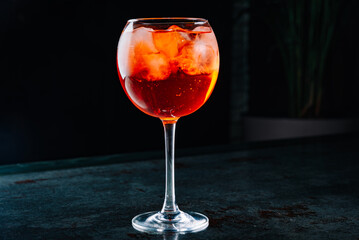 alcoholic cocktail in a glass stands on a table in a bar or restaurant