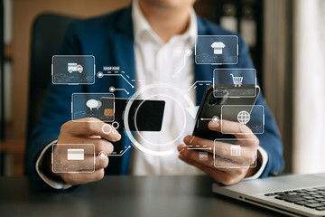 Close up of Hand using credit card and smartphone, laptop computer on wooden desk with VR icon chart graph diagram.