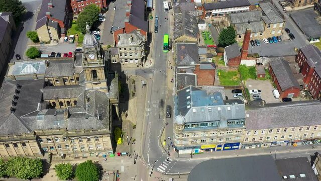 Aerial drone footage of the town of Morley in Leeds West Yorkshire, England showing the beautiful British town main street and housing estates from above on a sunny summers day.
