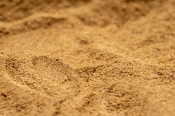 Pile of cinnamon powder as background, spice or seasoning as background. Close-up cinnamon powder