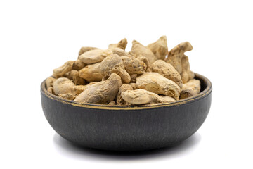 Dried Organic Ginger root isolated on white background. Ginger root or Dry Adrak in bowl