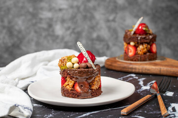 Chocolate, Strawberry and Pistachio Cake. Delicious cake on dark background