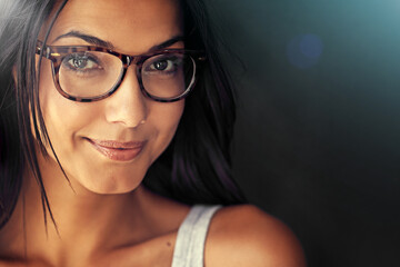 Woman, face and smile with glasses and vision with designer frame with prescription lens on studio...