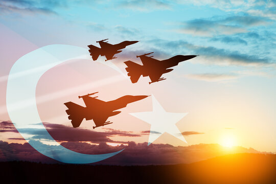 Aircraft silhouettes on background of sunset with a transparent Turkey flag. Turkish Air Force Foundation Day. - Powered by Adobe