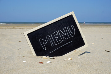 Menu written at the beach