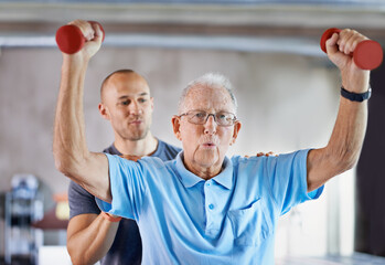 Physiotherapist, senior man exercise and weight training for health and wellness therapy in...