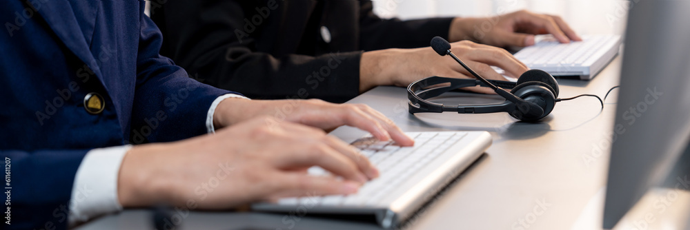 Aufkleber panorama focus headset on call center workspace desk with blur background of operator team or telesa
