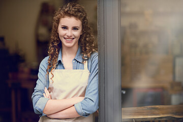 Smile, arms crossed and portrait of woman at restaurant for small business, coffee shop or waiter. Entrepreneur, happy and space with female barista at front door of cafe for diner in food industry