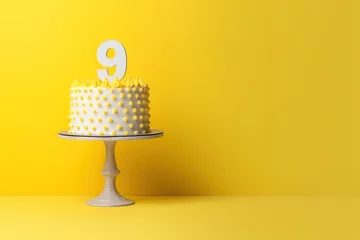 Fotobehang Birthday cake on a 9 years decorated with topper number nine on a yellow background in a minimalist style. Copy space. Generative AI © Alexandr_DG