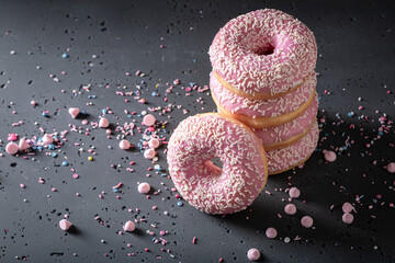 Homemade and sweet pink donuts freshly baked.