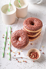 Tasty and fresh donuts as popular snack. Served with milk.