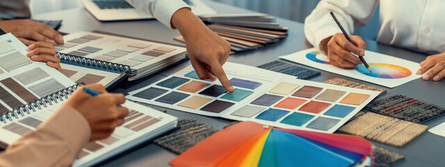 Group of professional interior designer and architect working together, planning and choosing color...
