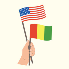 Flags of the USA and Guinea, Hand Holding flags