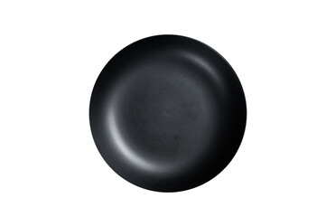Empty black craft plate on table. Table setting.  Isolated, transparent background