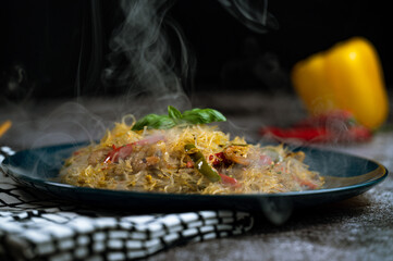 Smoky Asian salad with glass noodles, chicken, prawn, shrimp and vegetables