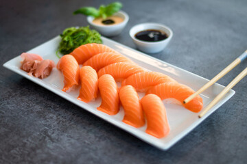 Fresh Sushi Roll with salmon.Japanese food. Copyspace black background.