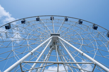 ferris wheel close-up. bottom view. sunny morning. entertainment park.