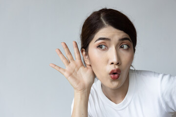 Excited happy woman listening to something, portrait of asian woman with hearing ear, concept of good rumor, gossip, hard of hearing treatment, fake news immunity, good news