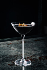 alcoholic cocktail in a glass stands on a table in a bar or restaurant