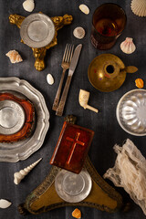 Various antique objects on black chalkboard background