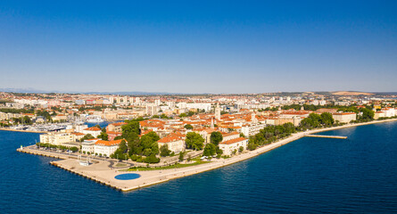 Naklejka na ściany i meble Aerial shot of Zadar old town, famous tourist attraction in Croatia. Waterfront aerial summer view, Dalmatia region of Croatia.