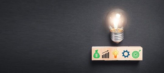 Business symbols on wooden block. Business process. Goal. Achievement