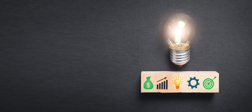 Business symbols on wooden block. Business process. Goal. Achievement