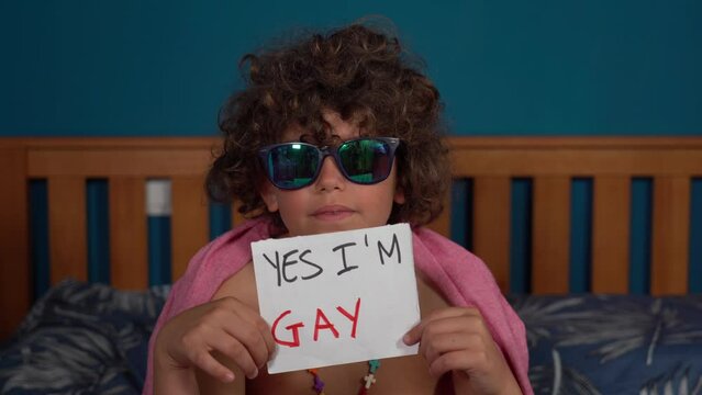8-year-old boy child says  yes, I am gay - Outing o coming out concept - LGBT free people - 
gay pride and defense of the rights of the homosexual and bisexual community