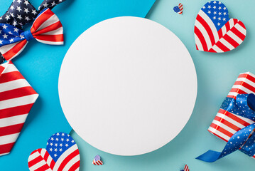 Obraz premium USA Unity Day imaginative greetings. Top view of symbolic items: tie, bow-tie, hearts featuring flag design, giftbox wrapped in thematic style, pastel blue backdrop with empty circle for text or ad