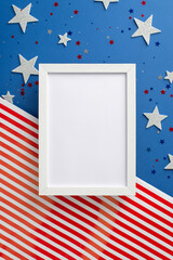 Obraz premium Celebrate spirit of Independence Day. Vertical top view showcases allure of symbolic adornments: stars, luminous confetti, photo frame on American flag background with space, ideal for text or picture