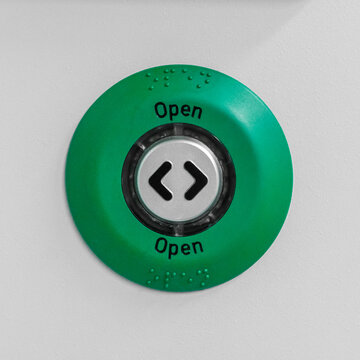 Industrial 'OPEN' button normally seen in factories and public transport shot straight on.