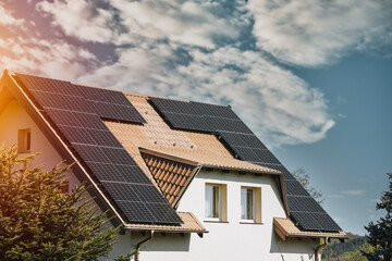 Fototapeta premium Concept of sustainable future. Solar roof installation company. Solar Panels and Photovoltaic.