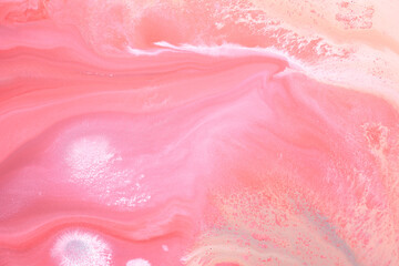 Multicolored creative abstract background. Red pink alcohol ink. Waves, stains, spots and strokes of paint, marble texture