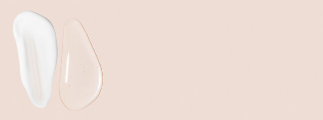 Drops of transparent gel and a dab of white cosmetic cream. On a beige background.