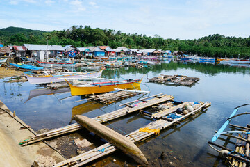 Fototapeta na wymiar Traditional fishing boats harbor at Siargao, Philippines.