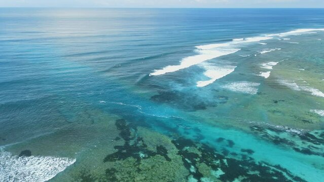 Transparent ocean with waves and rip current. Aerial view