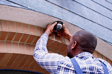 African American Handyman CCTV Camera Installer