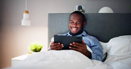 Man Lying On Bed Looking