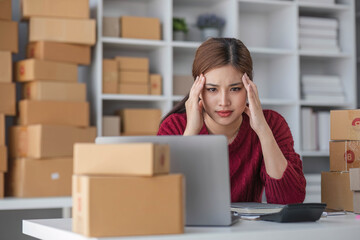 Small Business, Startup SME, Owner Entrepreneurs. Asian woman with unsuccess business online shopping crying and serious face unhappy mood.