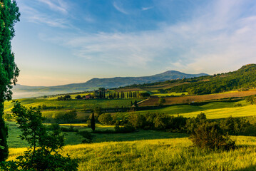 Fototapeta na wymiar The wavy hills of the landscape in Val d'Orcia from San Quirico d'Orcia